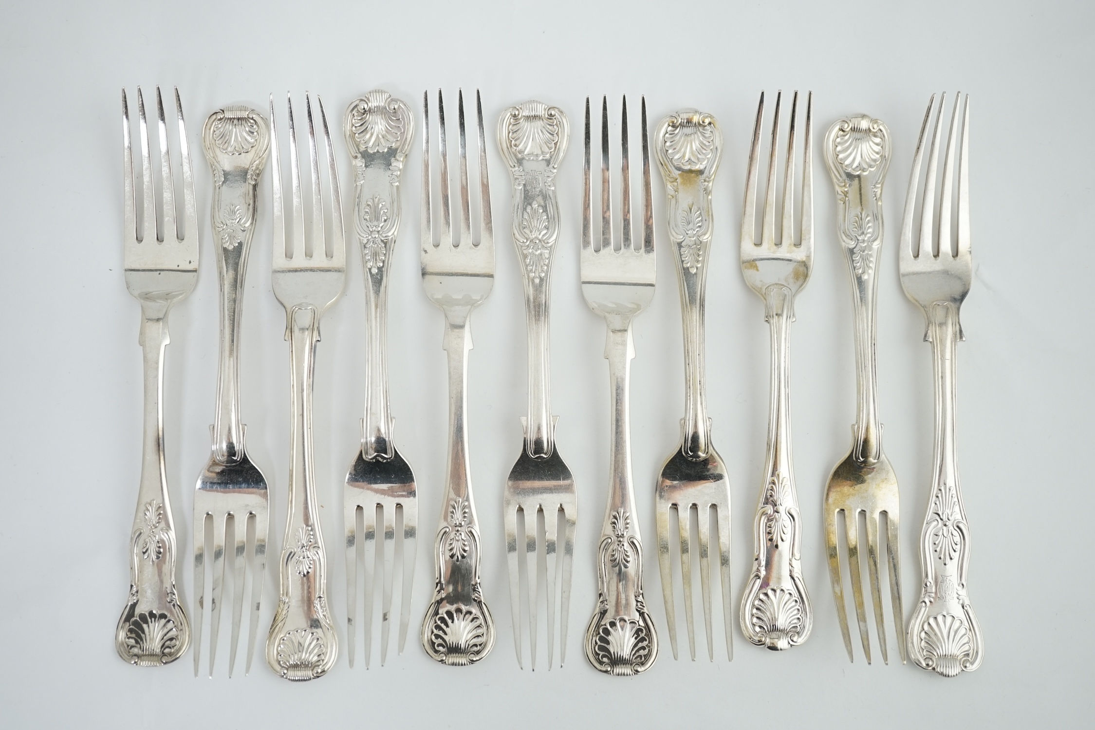 A harlequin set of eleven Georgian and Victorian silver Kings pattern table forks, various dates and makers, 32.8ozs.